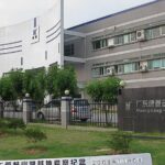 Custom rubber molding press and precision engineered rubber components in an industrial facility